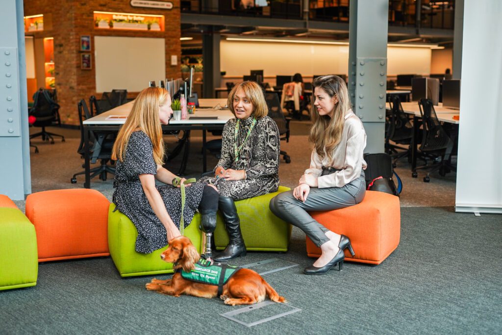 Group of people with diverse disabilities meeting in an office