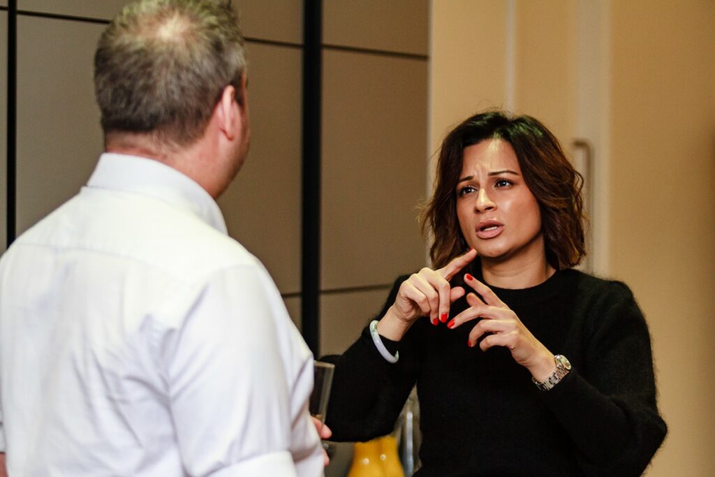 A photo of someone using sign language.