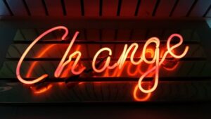 A red neon sign spelling out the word Change.