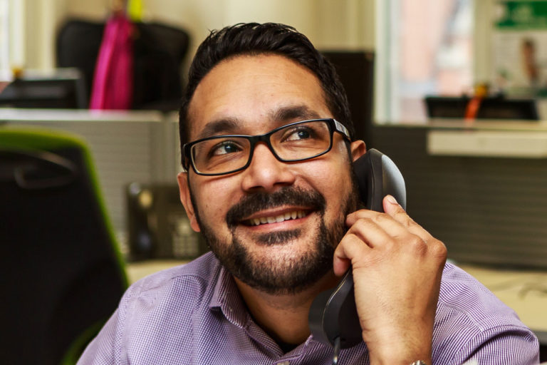 A man using a telephone.