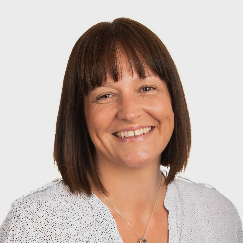 Headshot of Georgina Whitehead, a smiling white woman with short brown hair.