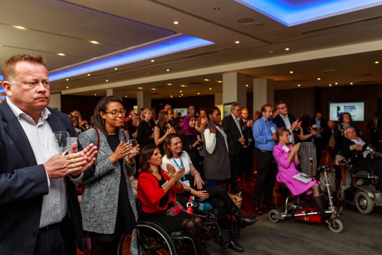 Audience applauds at a conference