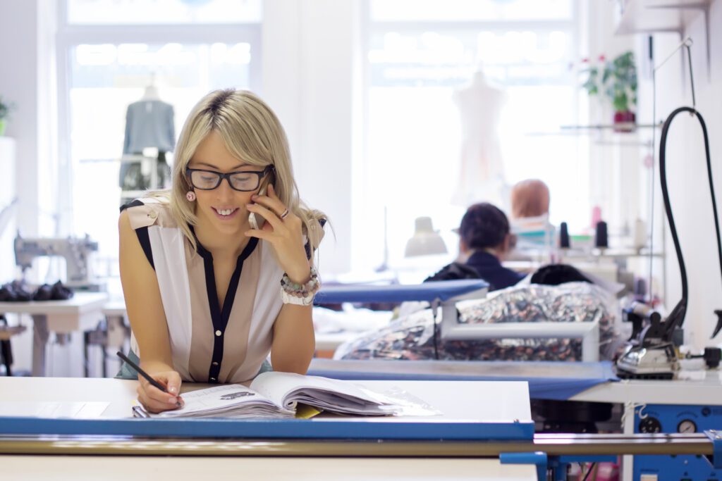 Woman taking customer orders by phone