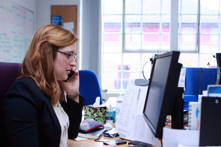 Angela Matthews working in the BDF office at her desk