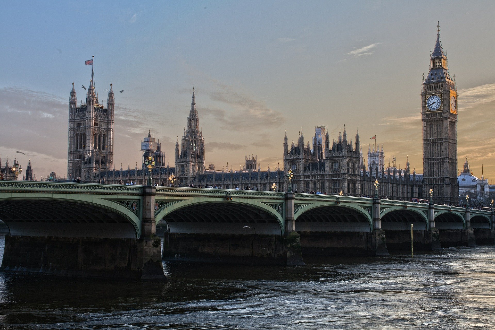 View of Westminster Bridge, Big Ben and the Houses of Parliament at dusk.