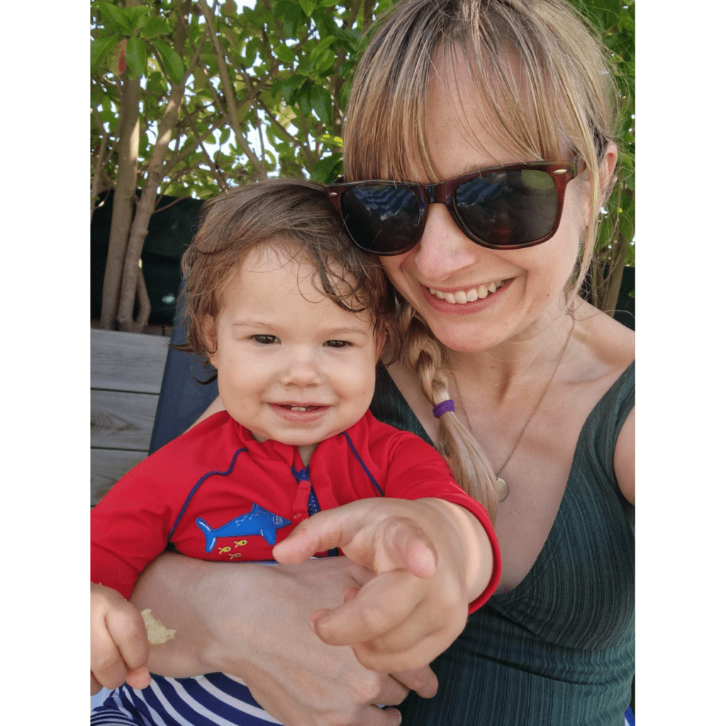 Vicky Harker smiling at the camera with her daughter