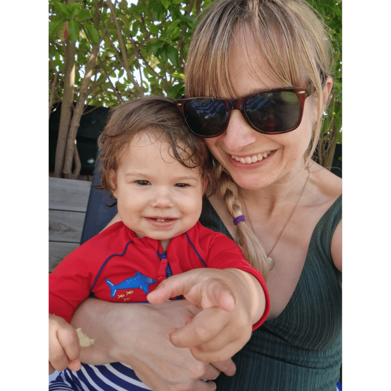 Vicky Harker smiling at the camera with her daughter