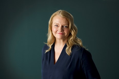 Headshot of Carolanne Minashi, a white woman with blonde hair.