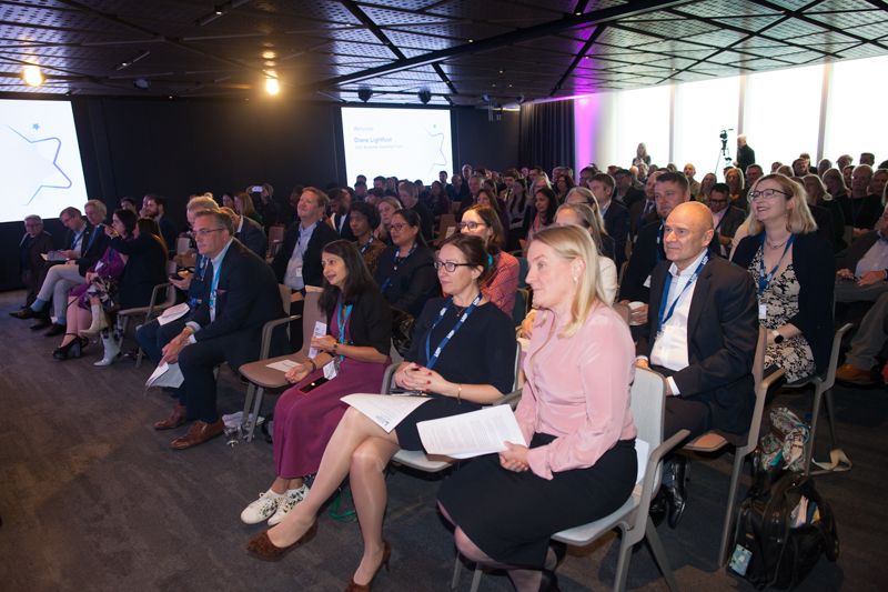 A sitting audience at an event.