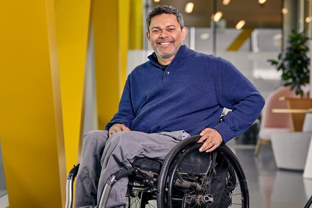 Headshot of AJ Nanayakkara, D&I Director – Disability Inclusion, LEGO Group.